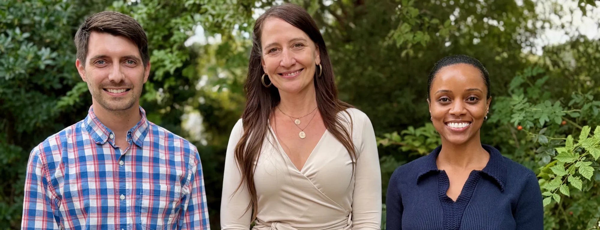 Orry Pratt, Carrie Teiken and Crystal Whitelaw standing side-by-side outdoors.