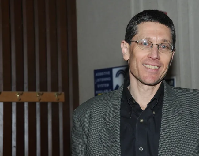 ene Robinson of the University of Illinois, shown here following his Jan. 6 talk at UC Davis, is heavily involved in "The Manhattan Project of Entomology." (Photo by Kathy Keatley Garvey)