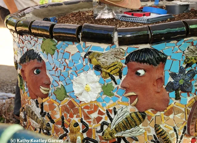 This art depicts "before" and "after": "before" when the man was deathly afraid of bees, and "after," when he developed admiration. (Photo by Kathy Keatley Garvey)