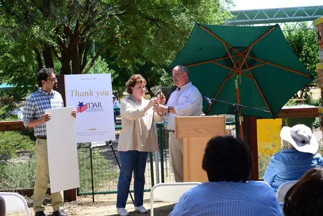 Ed Lewis (far right), professor and vice chair of of the UC Davis Department of Entomology and Nematology with state regent Debbie Jamison and bee scientist Brian Johnson. (Photo by Chris Akins)