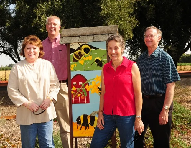 A visit to the Haagen-Dazs Honey Bee Haven last September: state regent Debbie Jamison, Fresno beekeeper Brian Liggett; Lynn Kimsey, director of the Bohart Museum of Entomlogy and UC Davis entomology professor; and Extension apiculturist Eric Mussen. (Photo by Kathy Keatley Garvey)