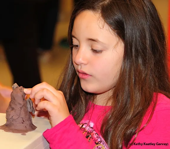 Ally Estrada, 10, of Vacaville, works with clay. (Photo by Kathy Keatley Garvey)