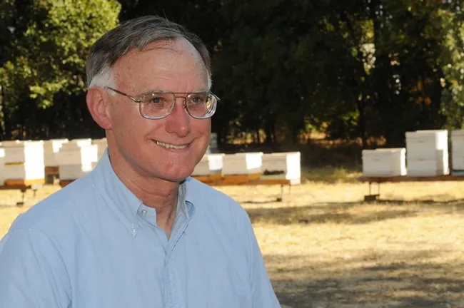 Extension apiculturist Eric Mussen in front of the apiary at the Harry H. Laidlaw Jr. Honey Bee Research Facility at UC Davis. (Photo by Kathy Keatley Garvey)