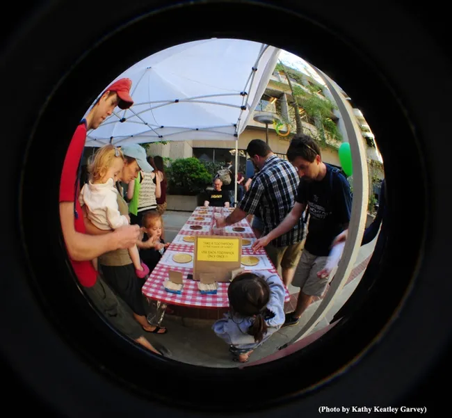 This was the scene of last year's honey tasting event at Briggs Hall. That's Extension apiculturist Eric Mussen, now retired, staffing the table. (Photo by Kathy Keatley Garvey)