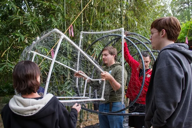 Figuring out the measurements are secretary Christine Melvin, member Hunter Bolt, president Marko Marrero, and member Sam Shook. (Photo by Alex Nguyen)