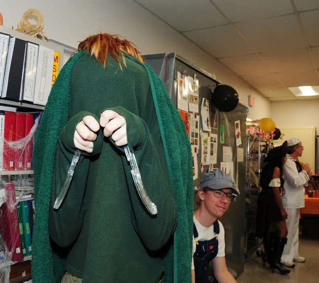 UC Davis entomology undergraduate student Benjamin Maples as a praying mantis. At right is graduate student Ziad Khouri. (Photo by Kathy Keatley Garvey)