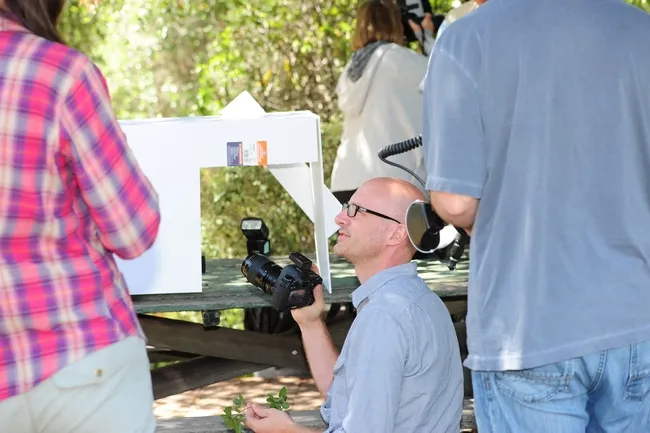 Alex Wild shows photographers some white box techniques at BugShot Hastings. (Photo by Kathy Keatley Garvey)