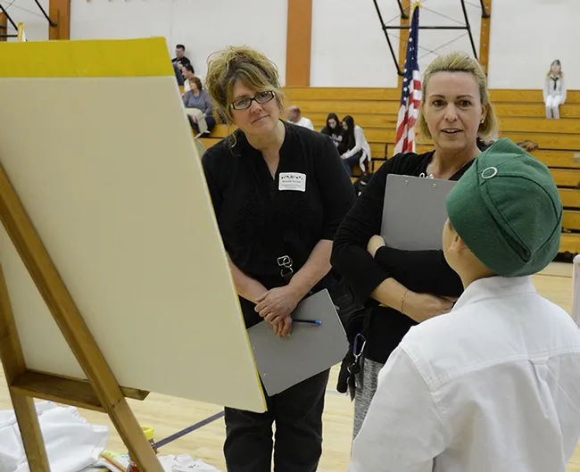 Solano County 4-H Presentation Day evaluators Brenda Torres (left) and Cara Kent listen attentively. (Photo by Kathy Keatley Garvey)