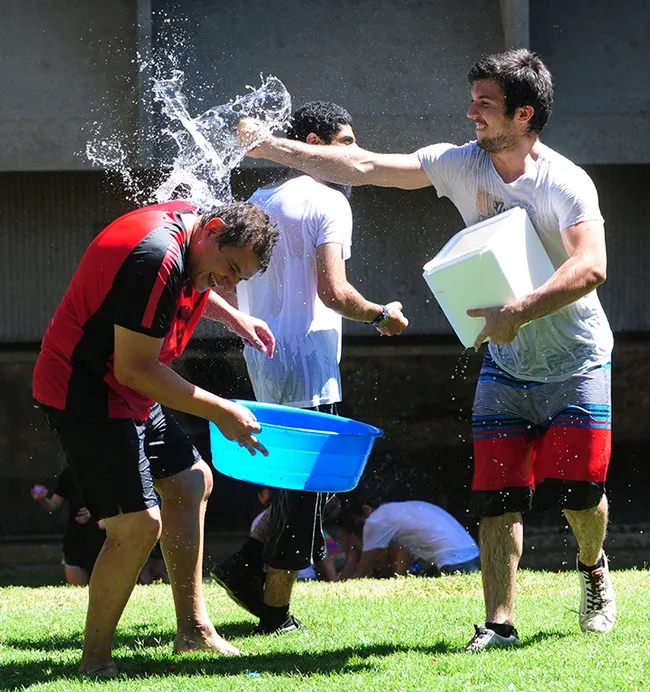 Tom Joseph, a visiting student from France (Aldrin Gomes lab) targets Christophe Morisseau of the Hammock lab. (Photo by Kathy Keatley Garvey)