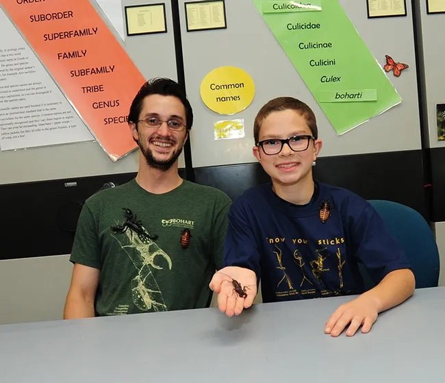 UC Davis entomology undergraduate student Wade Spencer (left) and budding entomologist Ty Elowe of Mesa, Ariz., show their bugs. (Photo by Kathy Keatley Garvey)