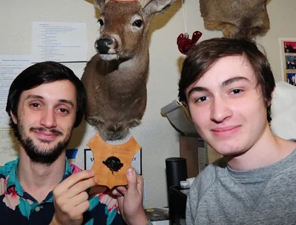 Wade Spencer (left) and Parras McGrath of the Bohart Museum hold a mounted rhino beetle head next to a mounted deer head. Spencer is a UC Davis entomology major, and McGrath is a high school student (The Met, Sacramento) who also helps out at the Bohart. (Photo by Kathy Keatley Garvey)