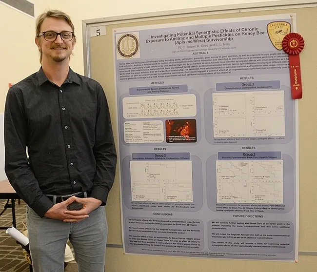 UC Davis graduate student W. Cameron Jasper won second place for his poster, "Investigating Potential Synergistic Effects of Chronic Exposure to Amitraz and Multiple Pesticides on Honey Bee (Apis mellifera) Survivorship." (Photo by Kathy Keatley Garvey)