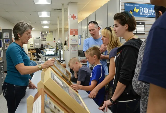 Lynn Kimsey (left), director of the Bohart Museum of Entomology and UC Davis professor of entomology, talks to visitors at a UC Davis Picnic Day. (Photo by Kathy Keatley Garvey)