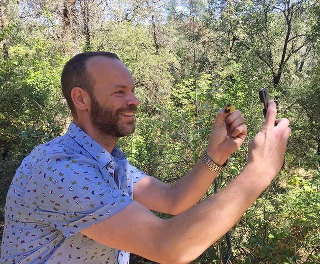Rob Stewart of "Rob on the Road" takes a selfie with a California dogface butterfly. (Photo by Greg Kareofelas)