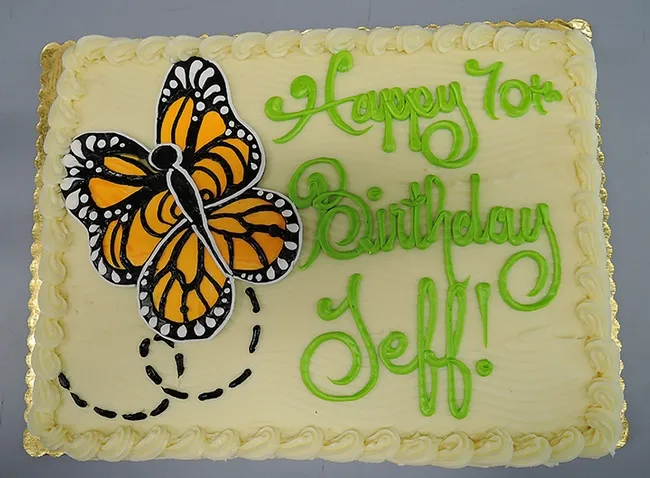 Entomologist Jeff Smith's 70th birthday cake featured a monarch butterfly motif. A 30-year volunteer at the Bohart Museum of Entomology, he curates the butterfly and moth collection. (Photo by Kathy Keatley Garvey)