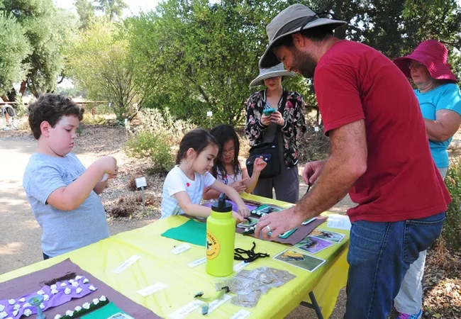 Staff research associate Charley Nye, manager of the Harry H. Laidlaw Jr. Honey Bee Research Facility, staffed the bee habitat table. (Photo by Kathy Keatley Garvey)