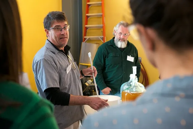 UC Davis winemaker Chik Brenneman leads a group at the Honey and Pollination Center's Mead Making Bootcamp. In back is Bruce Leslie, of Griffin Mead fame. "He is relocating to Chico to be the Olivarez Honey Bee Mead Maker!" said Amina Harris, center director. (Photo courtesy of the Honey and Pollination Center)