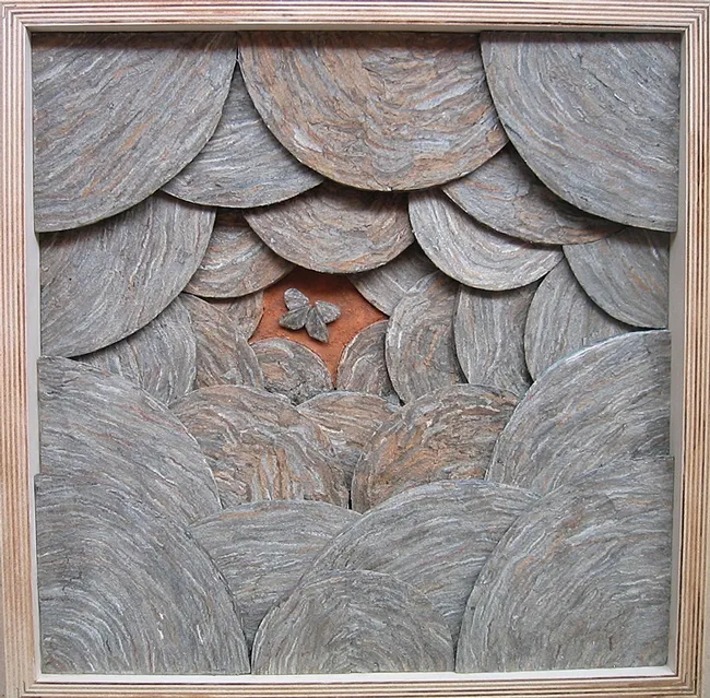 This is part of the trilogy of wall pieces created by artist Ann Savageau, professor emerita, UC Davis Department of Design. Her materials: hornet nest paper.