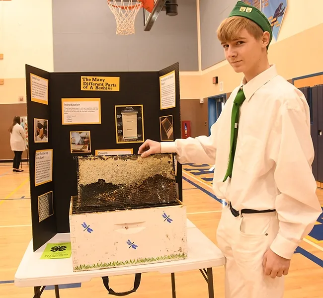Ian Weber of the Vaca Valley 4-H Club, a second-year beekeeper, displays his project at the Solano County 4-H Project Skills Day. He won a showmanship award. (Photo by Kathy Keatley Garvey)