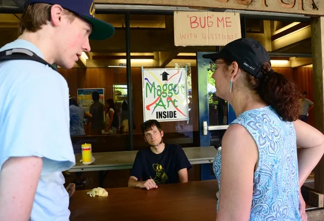 Ant specialist Zachary Griebenow, a first-year doctoral student in the Phil Ward lab, answers a question in the Bug Doctor booth. (Photo by Kathy Keatley Garvey)