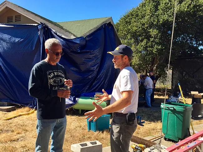 In this image, taken in October 2018, consultant and mentor Vernard Lewis (left), confers with Andrew Sutherland, UC integrated pest management advisor for Bay Area counties, about the Villa Termiti at the UC Berkeley Field Station. Sutherland, who holds a doctorate in entomology from UC Davis, was recently awarded state funding to remodel the Villa for future training of pest management professionals in the state. (UC ANR Photo by Pam Kan-Rice)