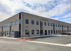 Rectangular 2-storey building made of cement blocks