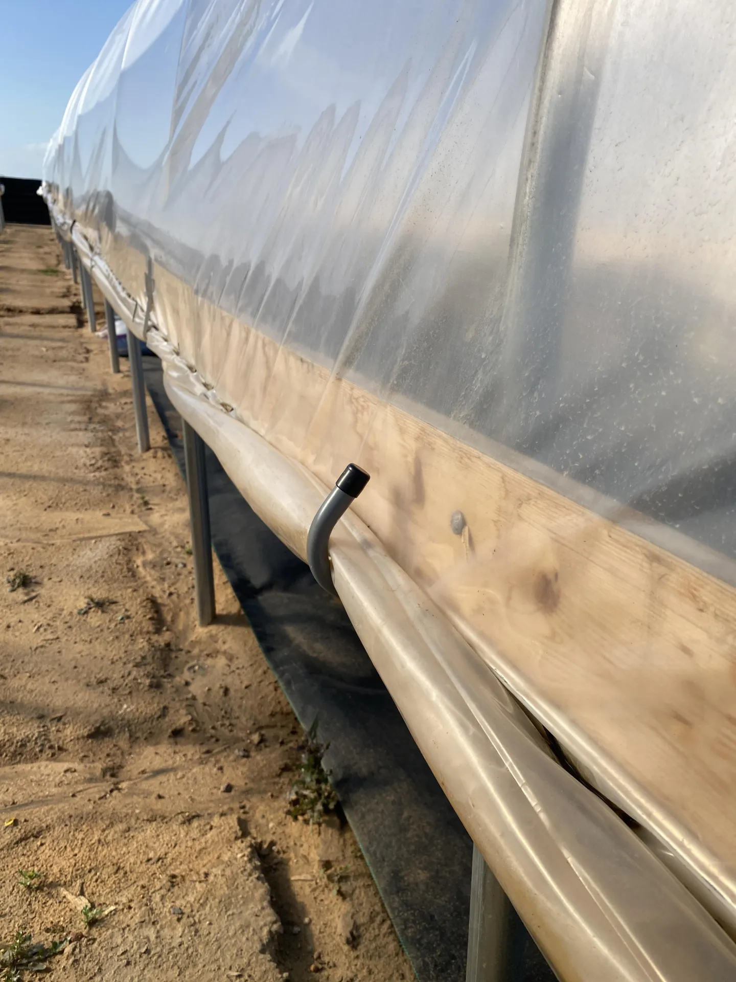 Figure 9. The plastic was rolled inwards and held up with 4-inch hand hooks.