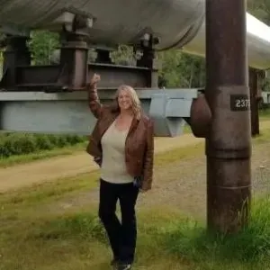 Person standing in front of elevated garden