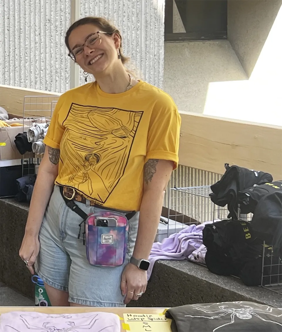 Doctoral candidate Abby Lehner wearing the T-shirt, "Scream," that she designed.