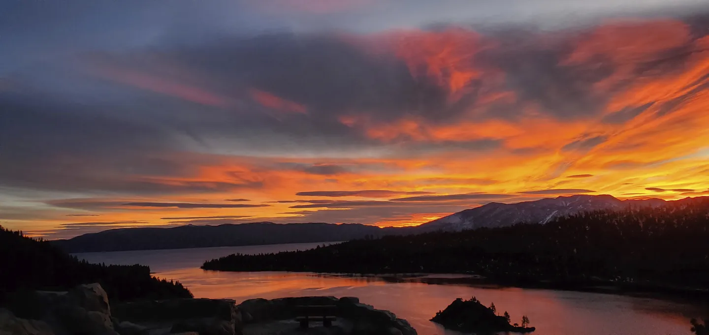 Sunset lake view within a mountain range.