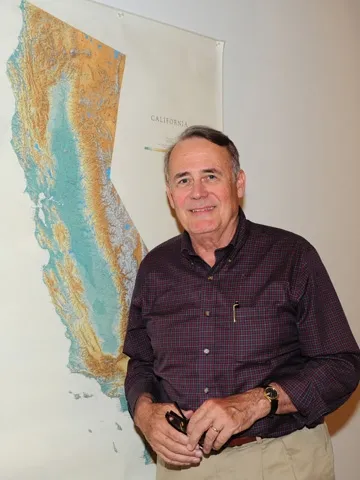 James R. Carey in front of a California map. (Photo by Kathy Keatley Garvey)