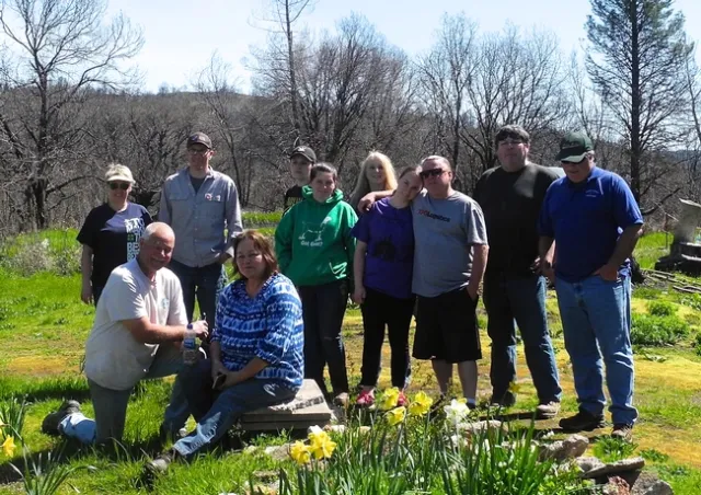 Feather Falls residents, Butte County 4-H members and family, and SPI foresters gather for a group photo at tree planting event on March 31, 2019 in Ponderosa Fire Area, Feather Falls, CA.