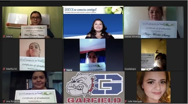 People in online class hold certificates.