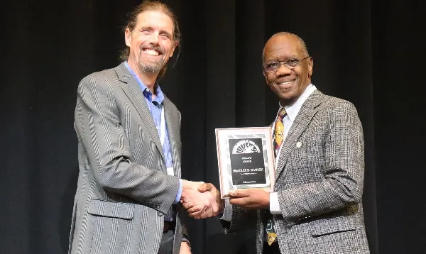 Brad Hanson (left) receives Fellow Award from WSWS President Joel Felix (photo credit: A.L. Simoes Araujo)