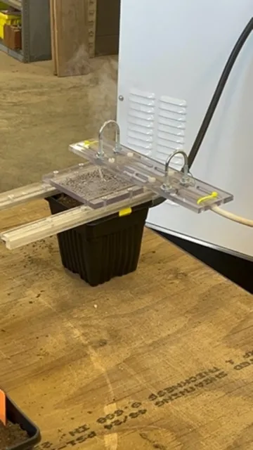 Figure 2. Pulse electric field application in a pot study with yellow nutsedge tubers. The PEF energy quickly warms the soil; notice the water vapor. https://youtu.be/SV9zoXpvn84?si=RQh_ctDkIR-jD3ZL