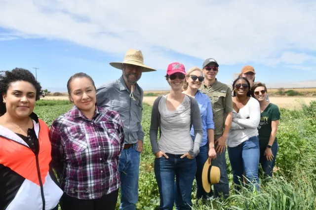 A group of people visit the West Side Research and Extension Center in Five Points