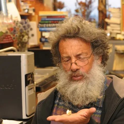 Professor Art Shapiro with his newly found cabbage white butterfly. (Photo by Kathy Keatley Garvey)