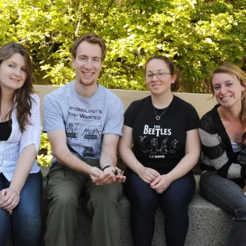 The winning Davis Linnaean Team is comprised of (from left) Kelly Hamby, Matan Shelomi, Kelly Liebman and Jenny Carlson. With them is mascot, Max. (Photo by Kathy Keatley Garvey)