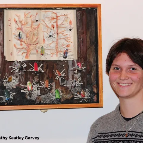Whitney Krupp with her beetle art work. (Photo by Kathy Keatley Garvey)