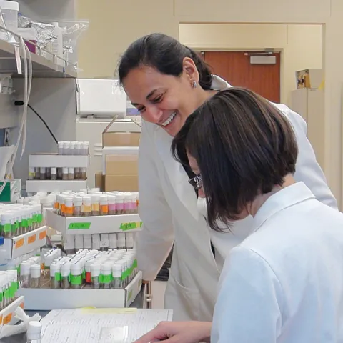 Molecular neurobiologist Anupama Dahanukar of UC Riverside working with Drosophila cultures with junior specialist, Adriana Medina.