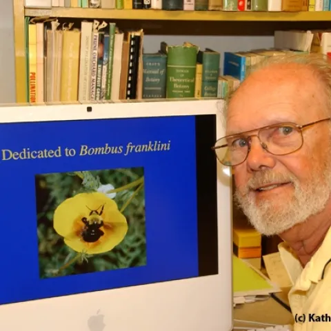 Robbin Thorp with his computer screen showing a photo he took of Franklin's bumble bee, one of the world's 100 most endangered species. (Photo by Kathy Keatley Garvey)