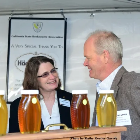 CSBA President Bill Lewis of the San Fernando Valley talks bees with Barbara Allen-Diaz, vice president of the UC Agriculture and Natural Resources (UC ANR) at the California Agriculture Day, State Capitol, in March. (Photo by Kathy Keatley Garvey)