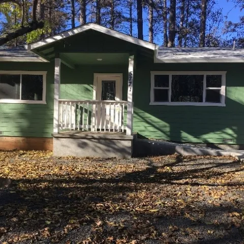 Surviving home with recently upgraded roofing, vents, and combustible materials separated from the house. Every home surrounding this house was lost to the Camp Fire.