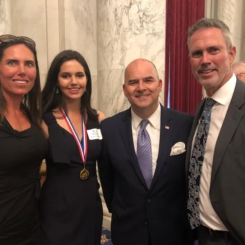 Elizabeth Sugarman, Sissy Sugarman, Ray Kerins of Bayer Corporation, and Shawn Sugarman at the Congressional Gold Medal award ceremony