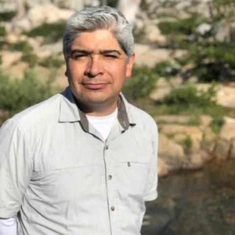 Man smiling at the camera.