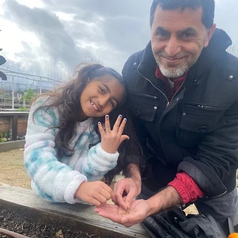 Family planting on a rainy day