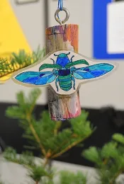 A colorful bark beetle decoration adorns