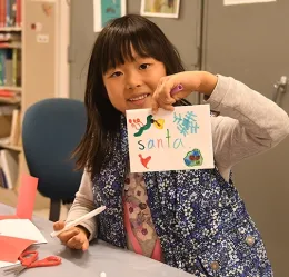 Amy Huang, 6, addressed her Parasitoid Palooza pop-up card to Santa. (Photo by Kathy Keatley Garvey)