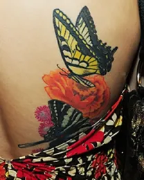 A tattoo contest will be part of the Bohart Museum of Entomology open house. This is a Western tiger swallowtail, Papilio rutulus, on a visitor at a recent UC Davis Picnic Day. (Photo by Kathy Keatley Garvey)
