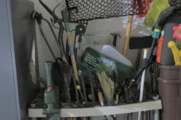 Unorganized garden tools - organize now so they are easy to find later.
